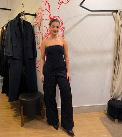 Calça de strass cae