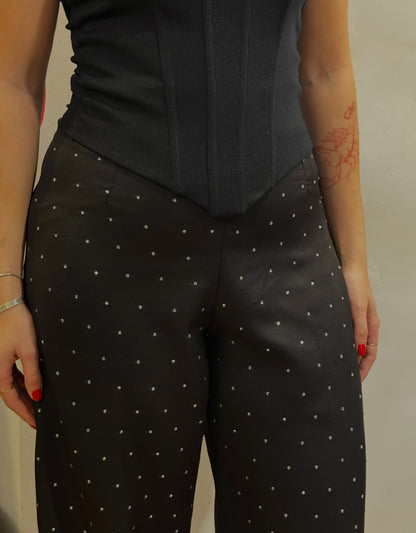 Calça de strass cae