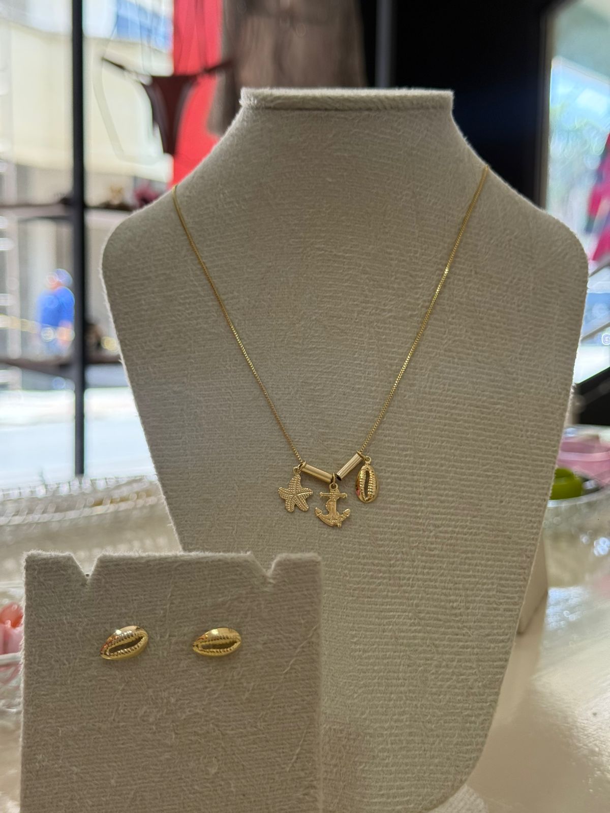 Conjunto náutico dourado