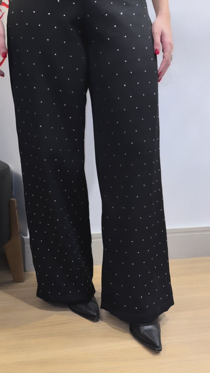 Calça de strass cae